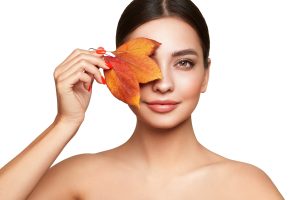 Woman holding leaf